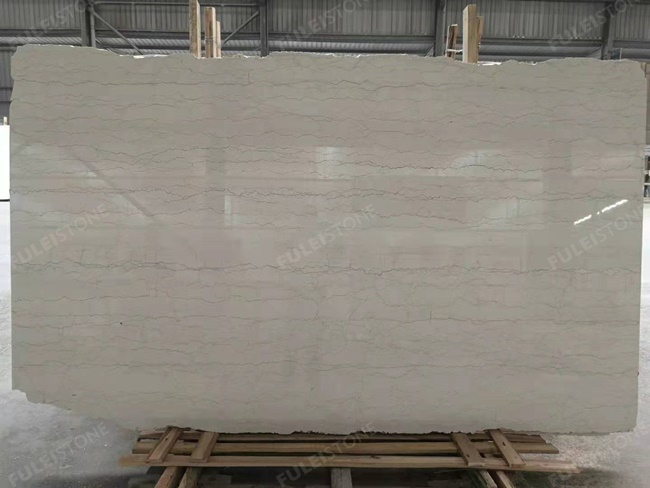 perlino bianco marble vein cut slabs with more veins