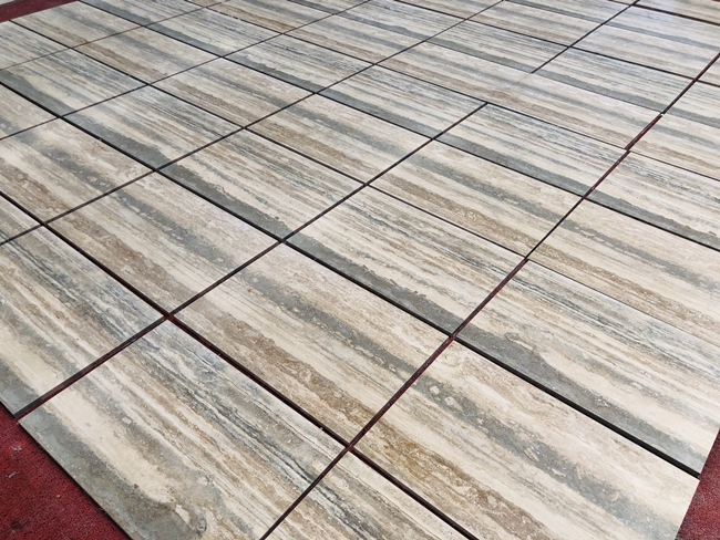 The Dry Lay of silver travertine tiles
